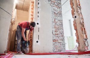 construction worker drilling wall during a home re 2026 01 07 01 01 43 utc scaled