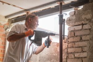man demolishing brick wall with jackhammer constru 2026 01 08 22 58 54 utc scaled
